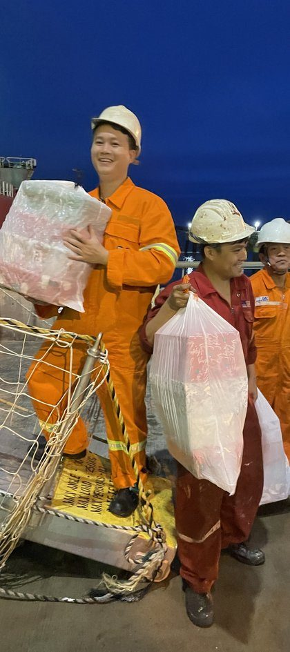 A crew member on a ship deck