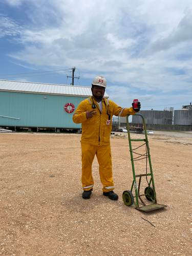 Crew member giving a peace sign outside the Seafarers Center