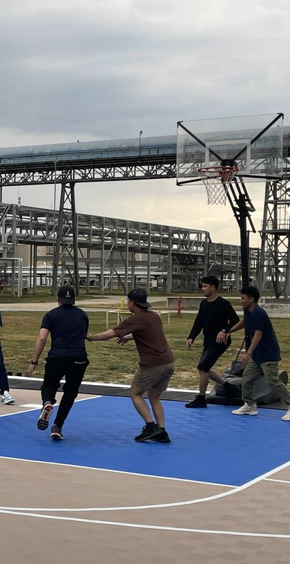 Volunteers playing basketball outside the Seafarers Center