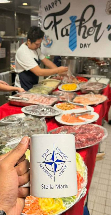 A Father's Day seafood spread at the Center, with a Point Comfort Seafarers Center mug in the foreground